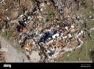 two-smashed-cars-middle-left-are-barely-distinguishable-monday-april-3-2006-at-a-home-that-was...jpg